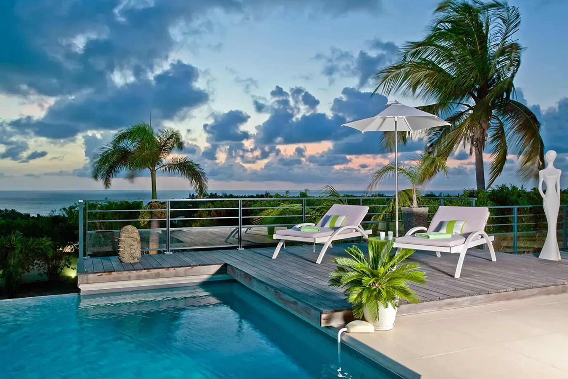 Covered terrace with living area and pool views.