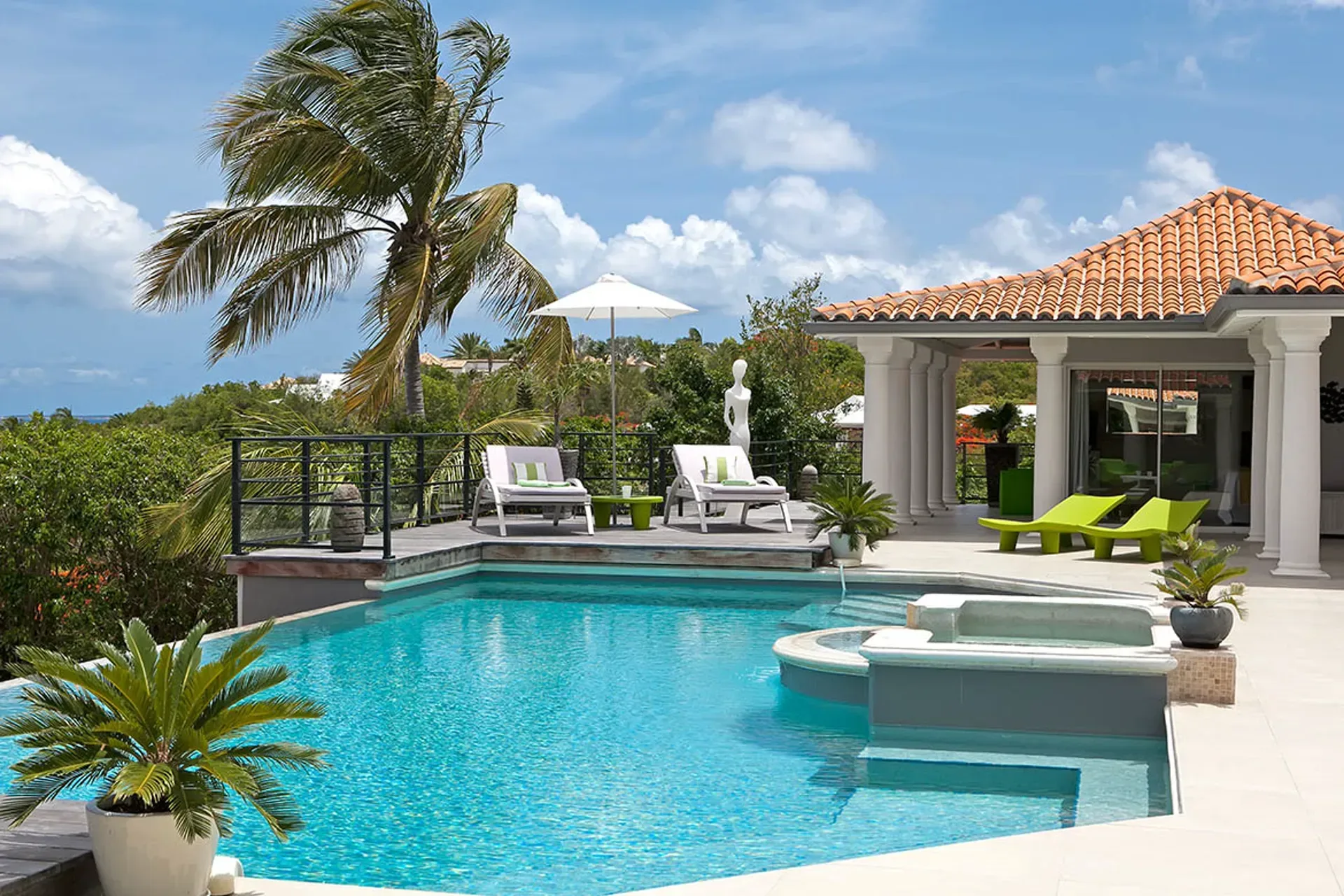 Terrace with pool and Mediterranean architecture.