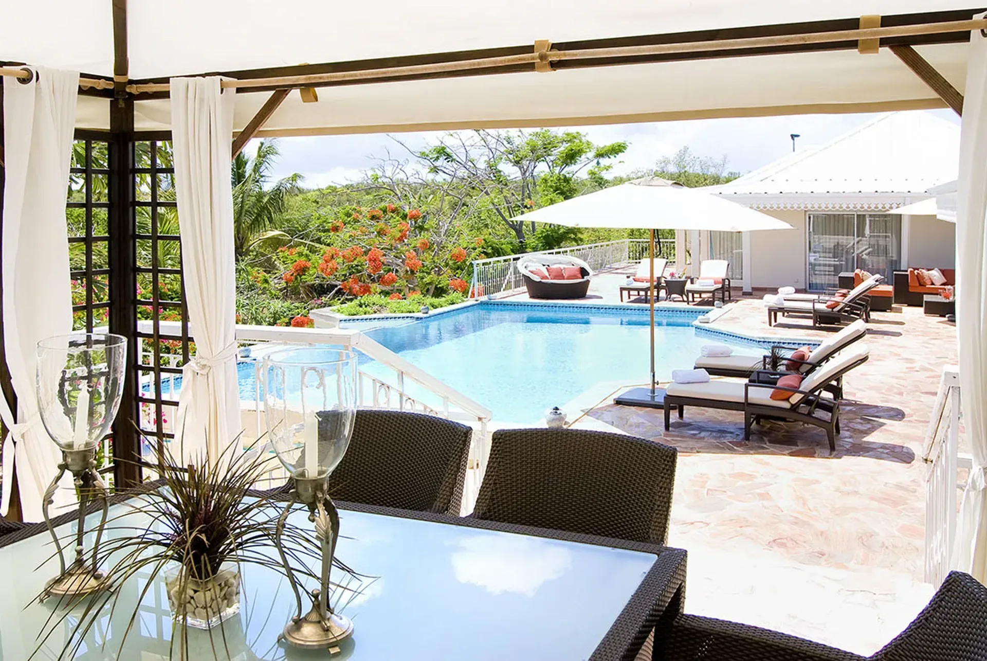 Wake up refreshed in a master bedroom with elegant tropical decor.