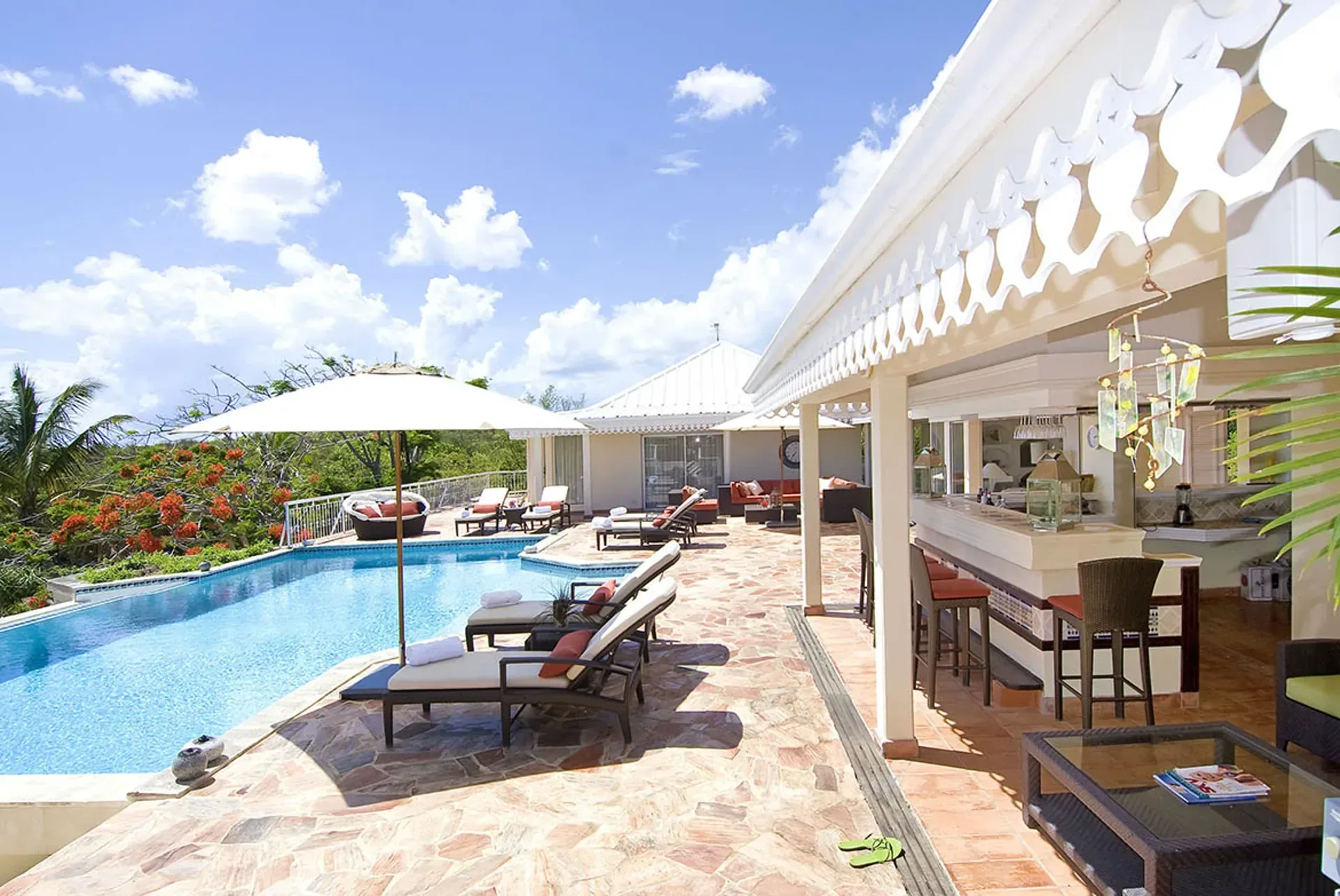 The pool area offers multiple spots for sun and shade.