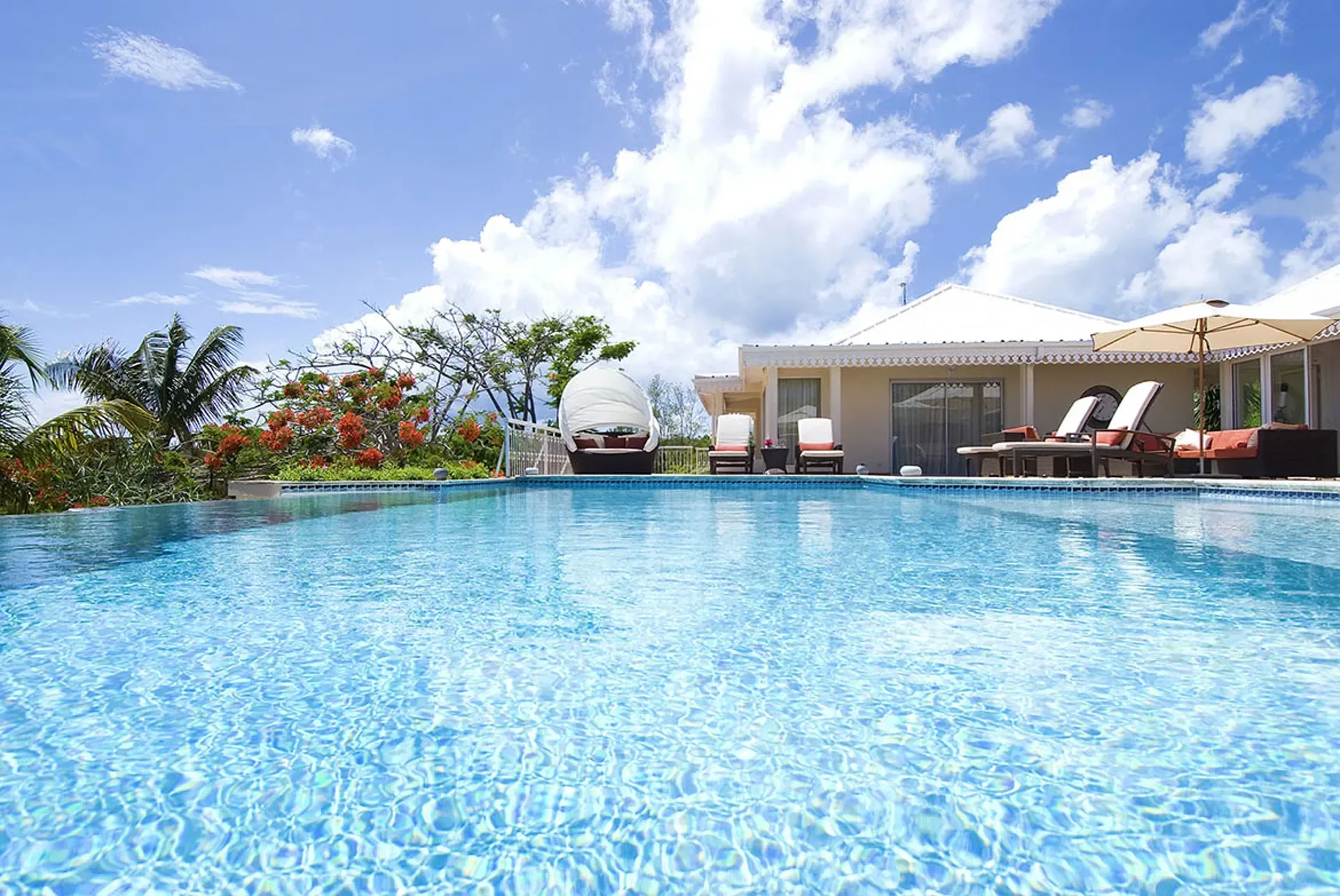 Evening ambiance by the pool creates magical Caribbean nights.