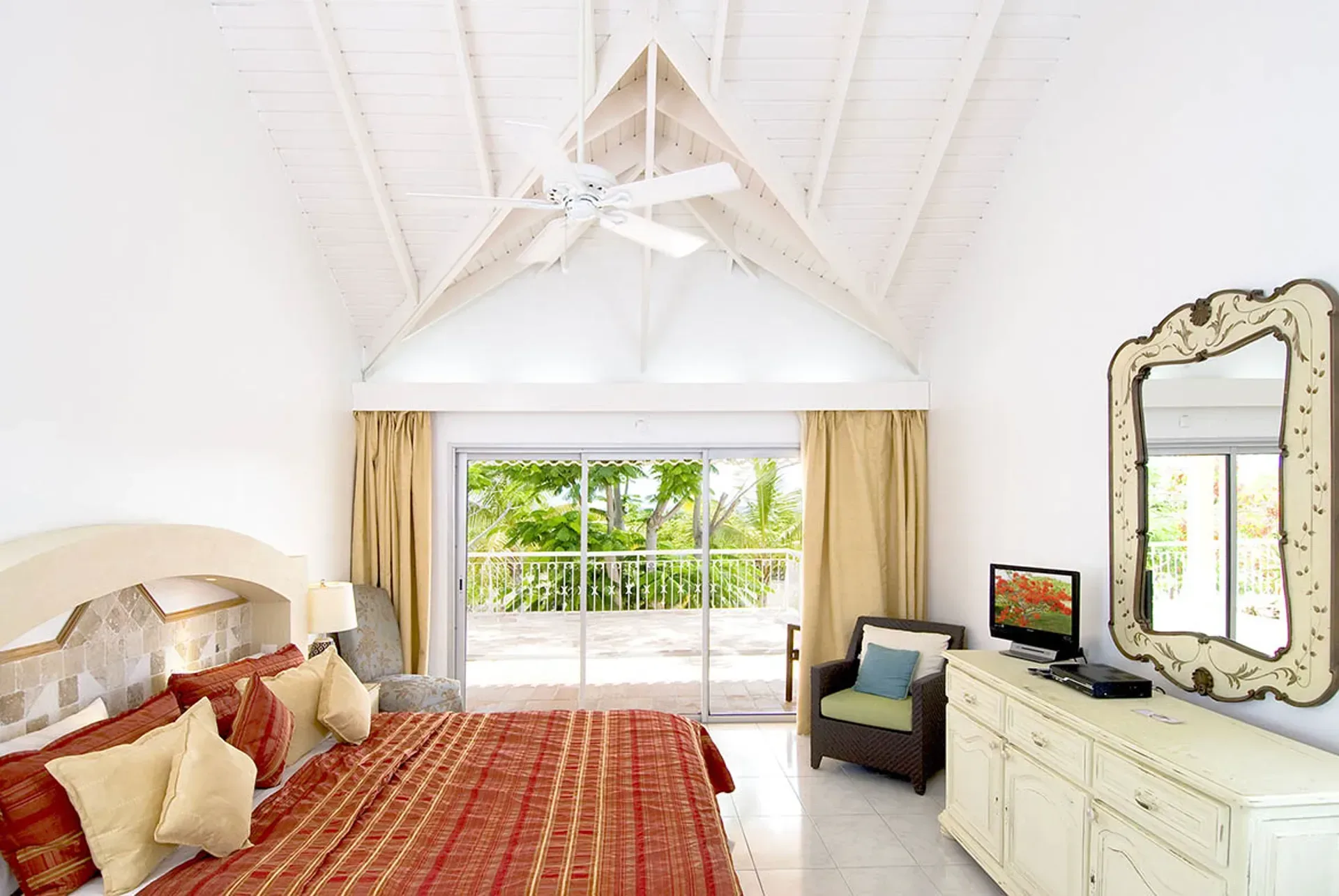 A covered terrace provides shade and comfort for outdoor living.