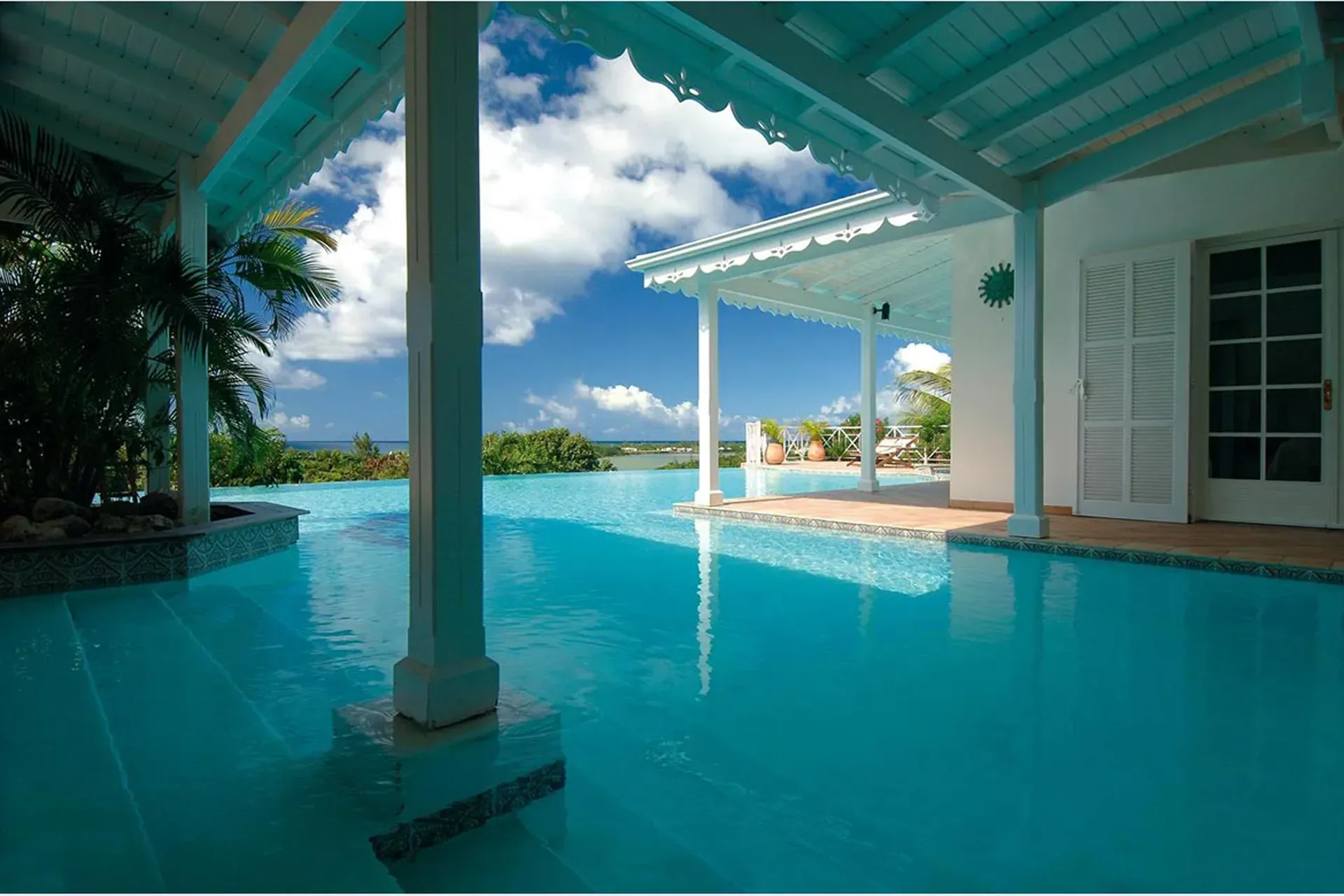 The pool area provides multiple spaces for sun and relaxation.