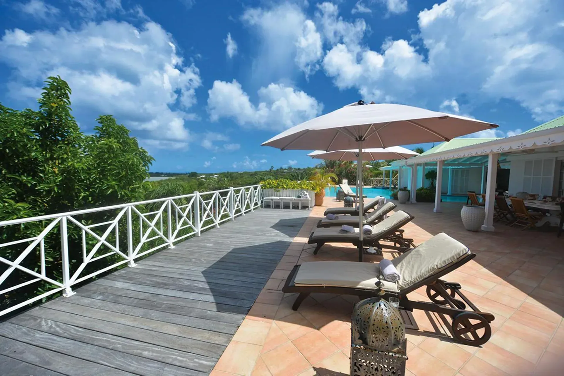 Lounge in style with beautiful garden and pool views.