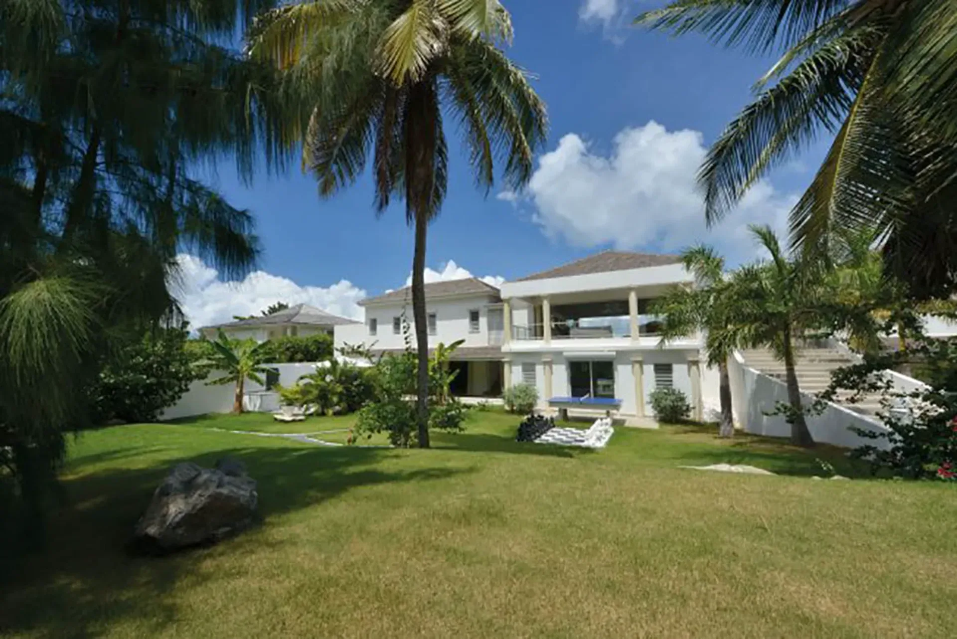 Your private estate with lush gardens, life-sized chess, ping-pong, and multiple pavilions for ultimate privacy.