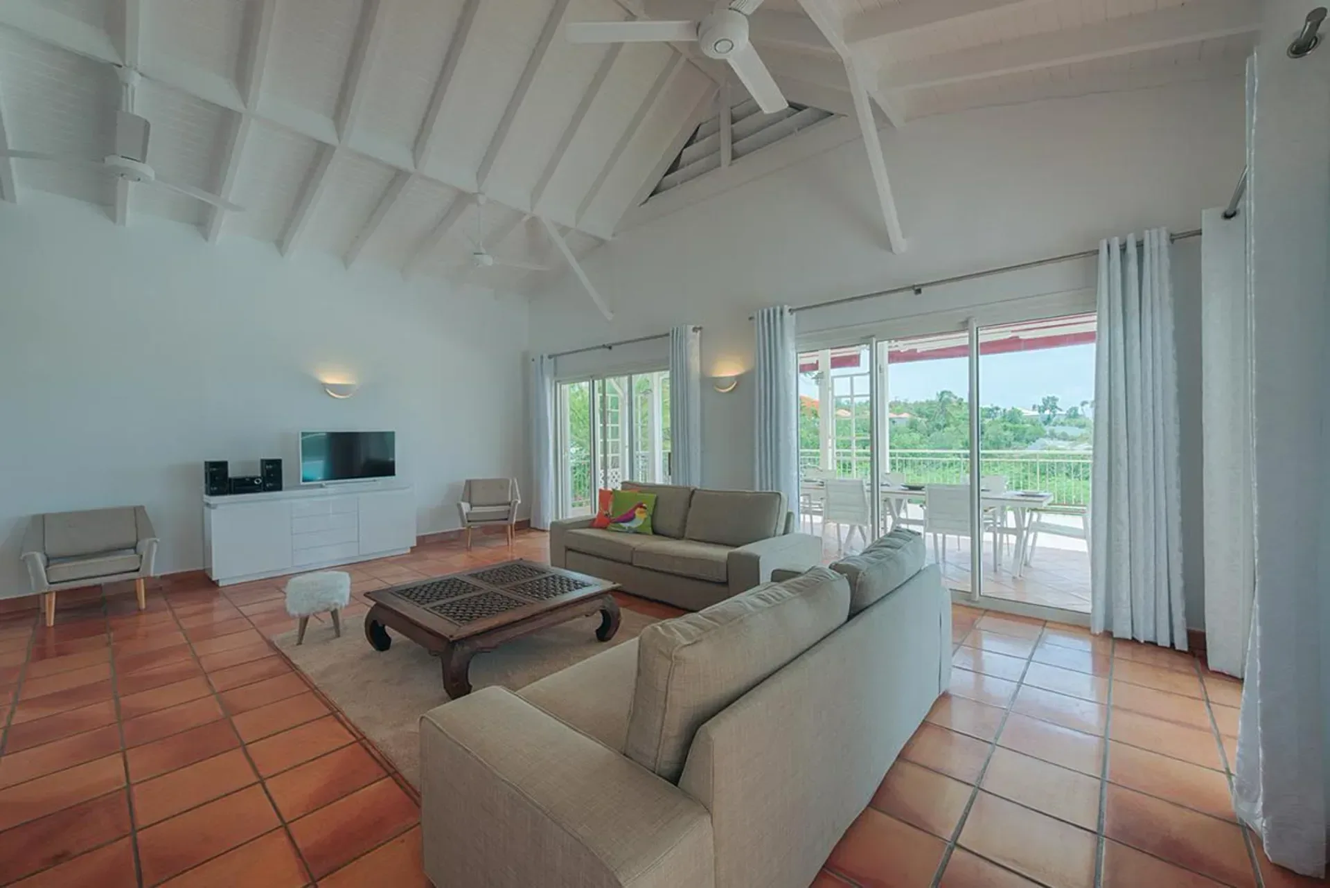 Enjoy spacious indoor-outdoor living with tropical views.