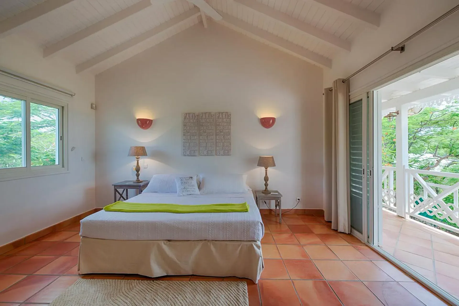 Enjoy bright living with sliding glass doors to your tropical balcony.