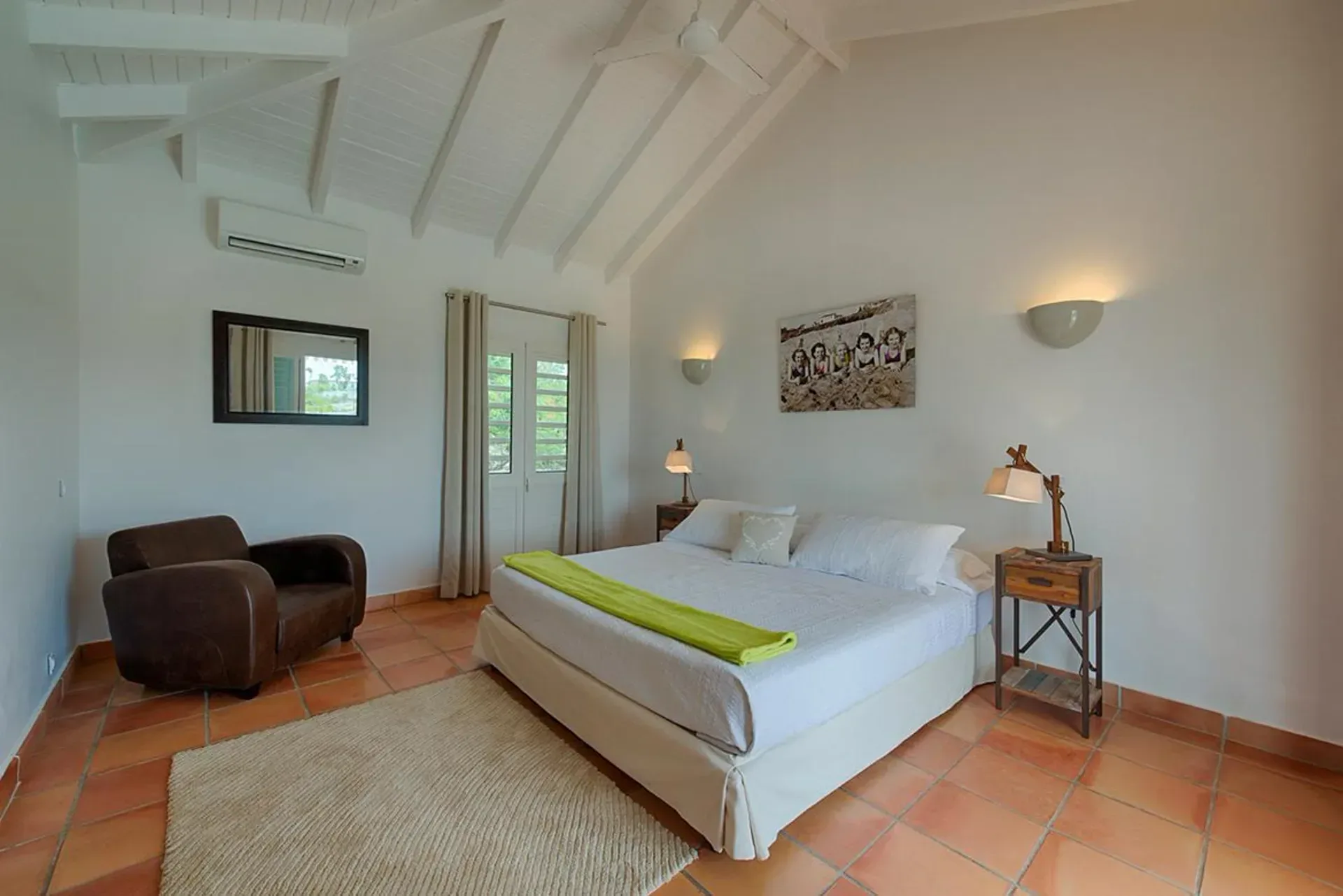 Rest in Caribbean-style elegance with vaulted ceilings.