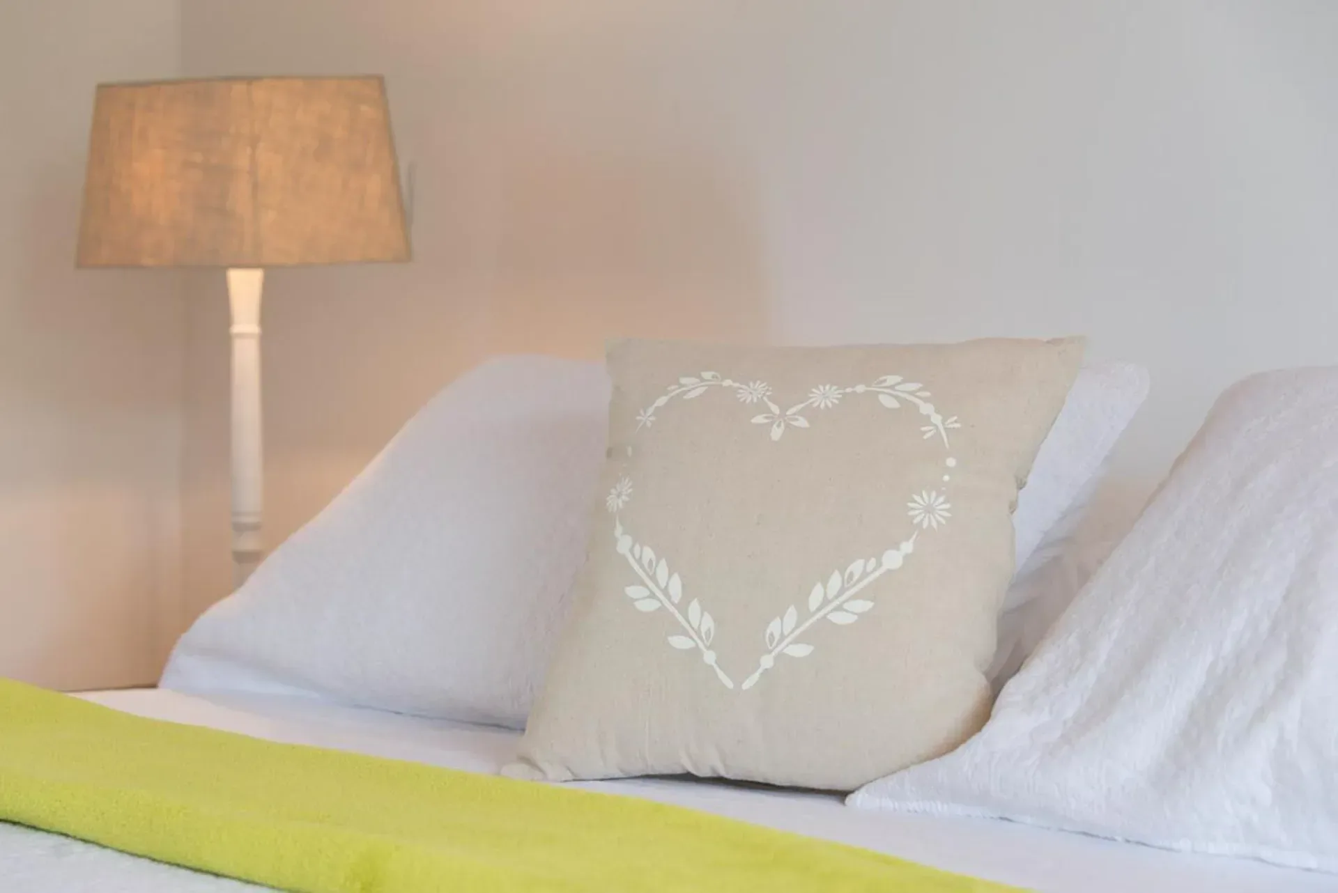 Discover cozy details with romantic pillows and soft linens.