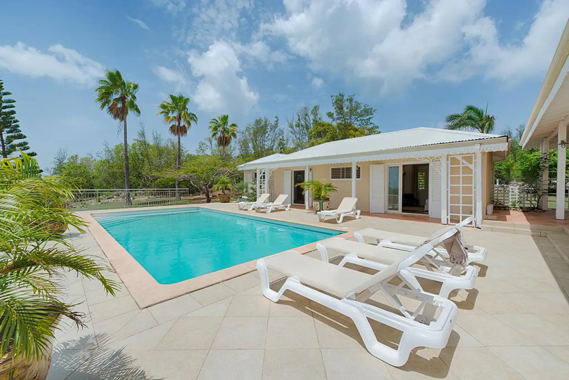 Relax by a sparkling private pool where sun-drenched terraces create your Caribbean getaway.