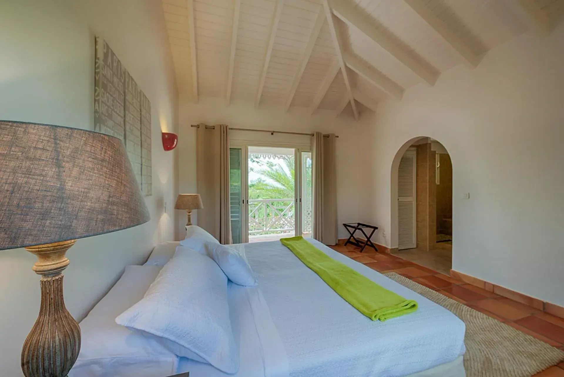 Wake up to bright comfort with private balcony and garden views.