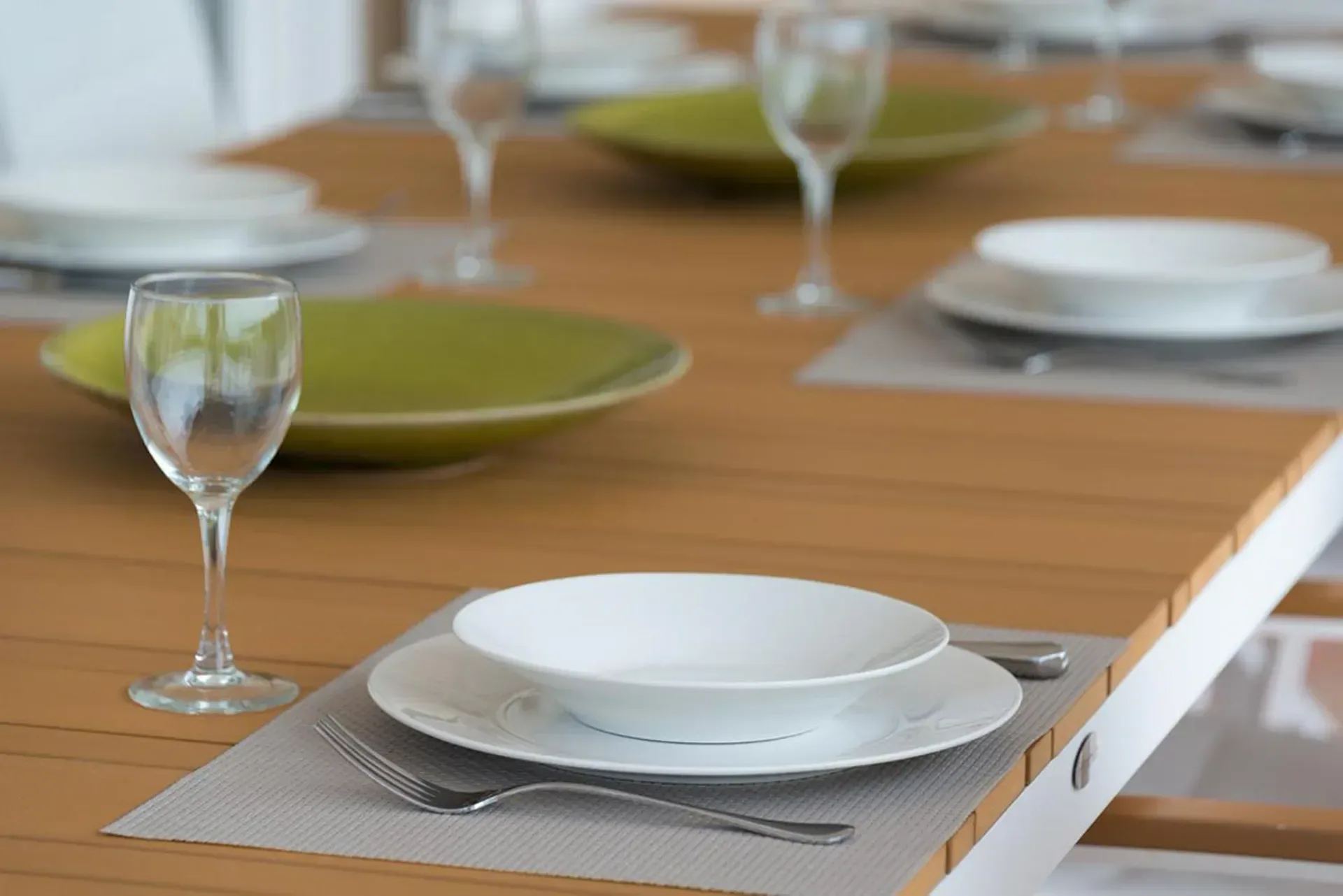 Gather for elegant al fresco dining with modern table settings.