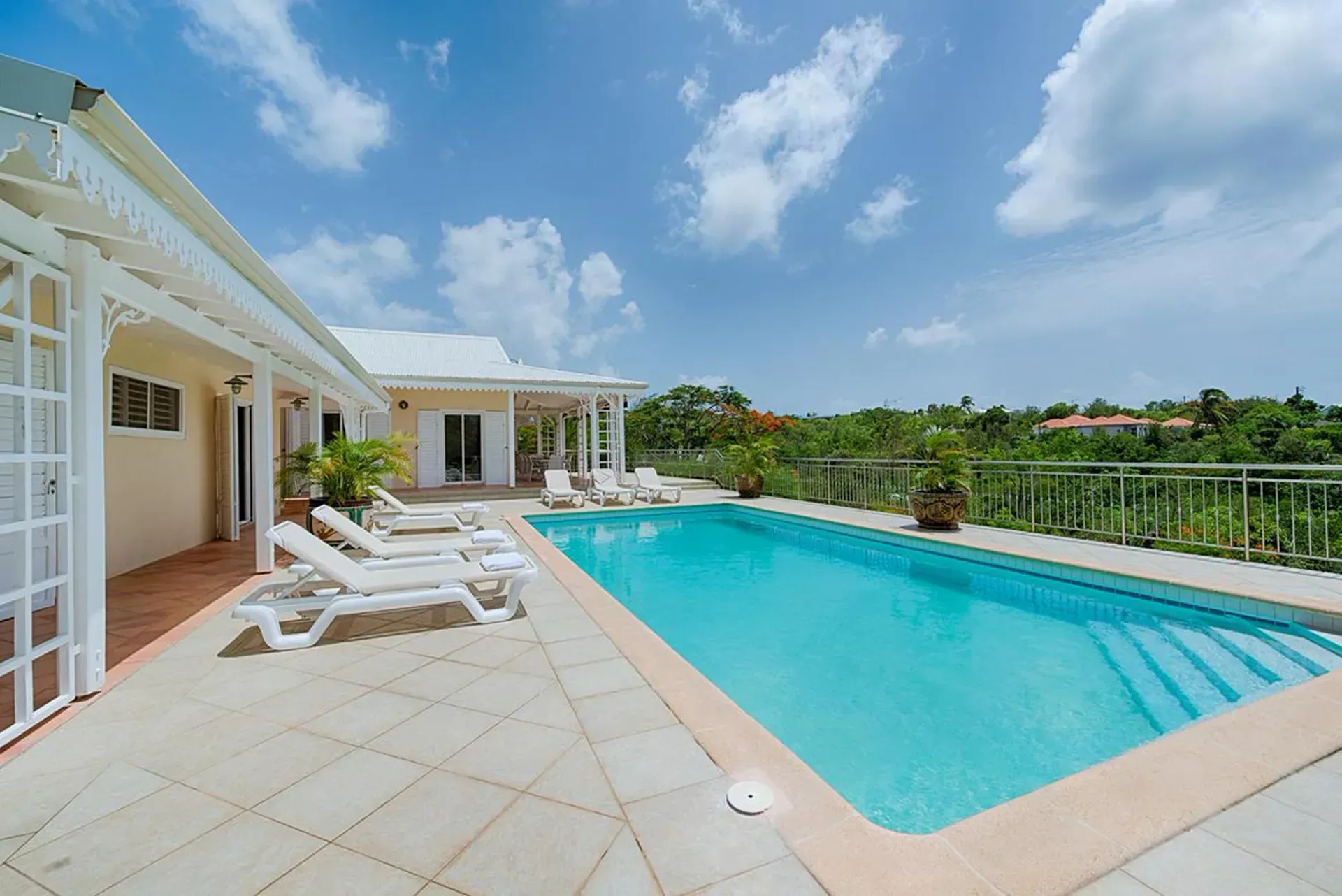 Unwind by your private pool with comfortable loungers and stunning tropical views.