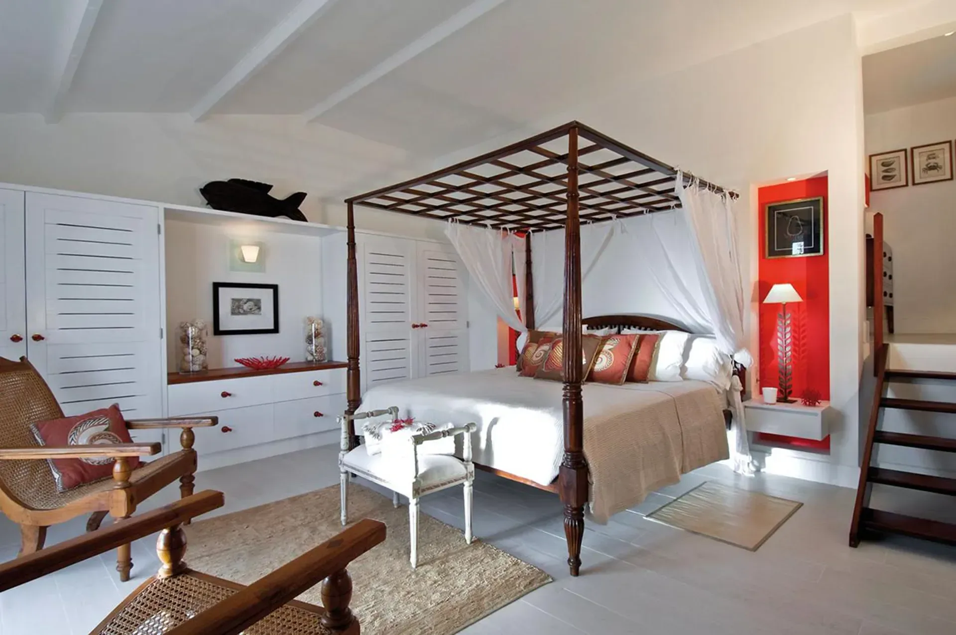 Stay in elegant comfort with a classic four-poster bed and bright Caribbean accents.