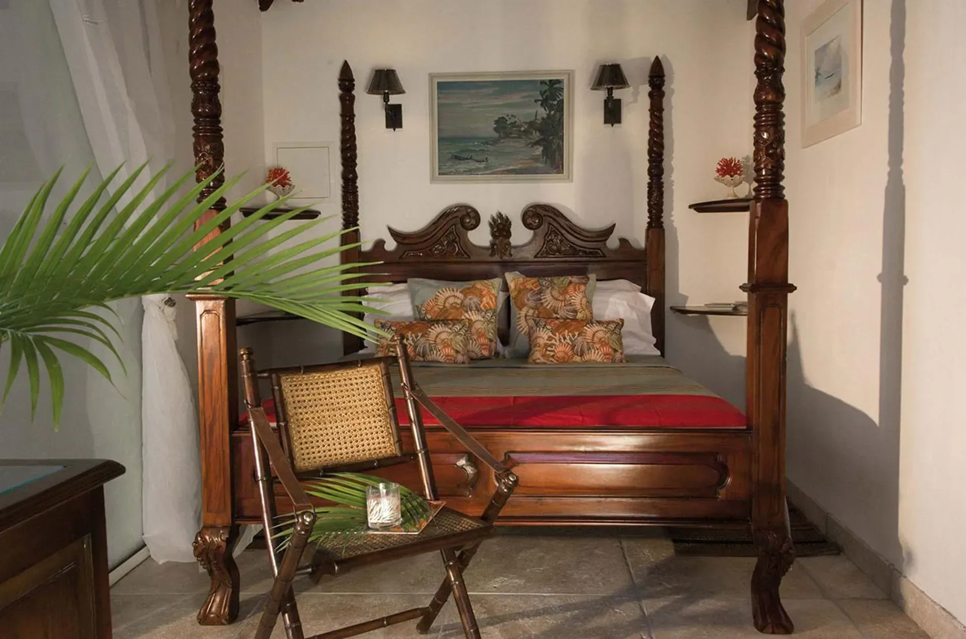 Relax in elegant tropical style with a hand-carved four-poster bed and Caribbean colonial charm.