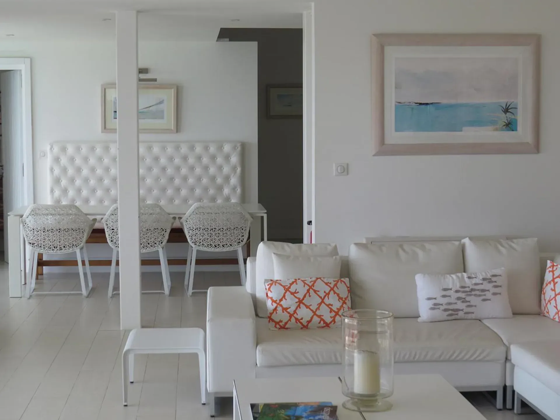 Experience elegant all-white living with contemporary coastal decor and stylish nautical accents.