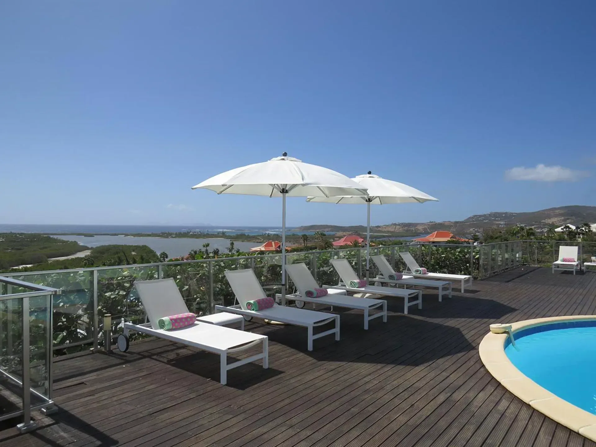 Soak up the sun on a stunning pool deck with comfortable loungers and breathtaking coastal panoramas.