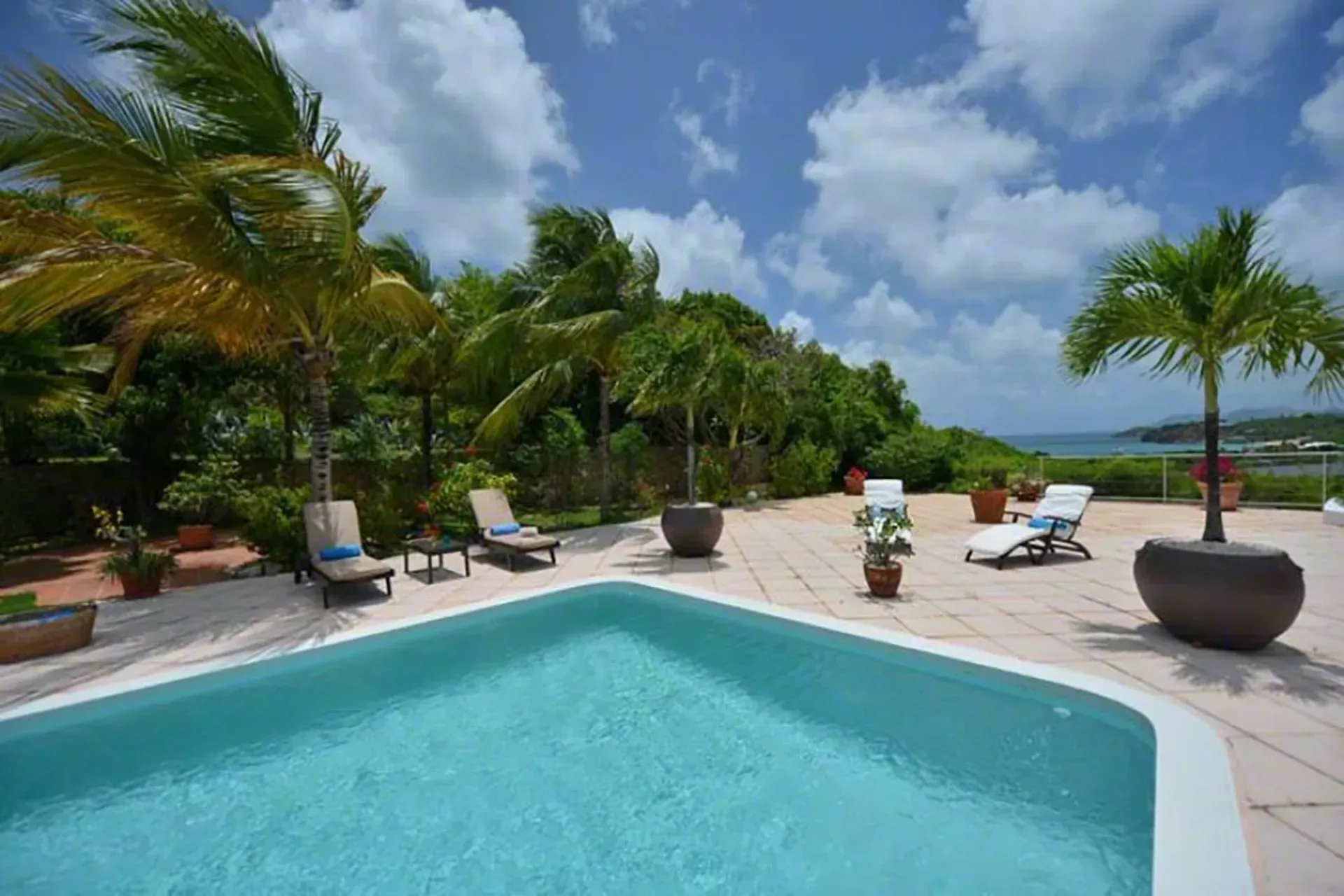 Your private pool with lounge chairs and panoramic ocean views.