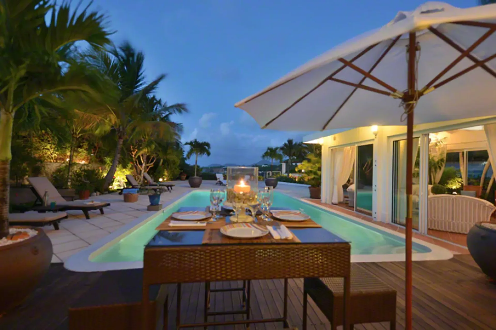 Dine al fresco with pool views, candlelight, and tropical breezes.